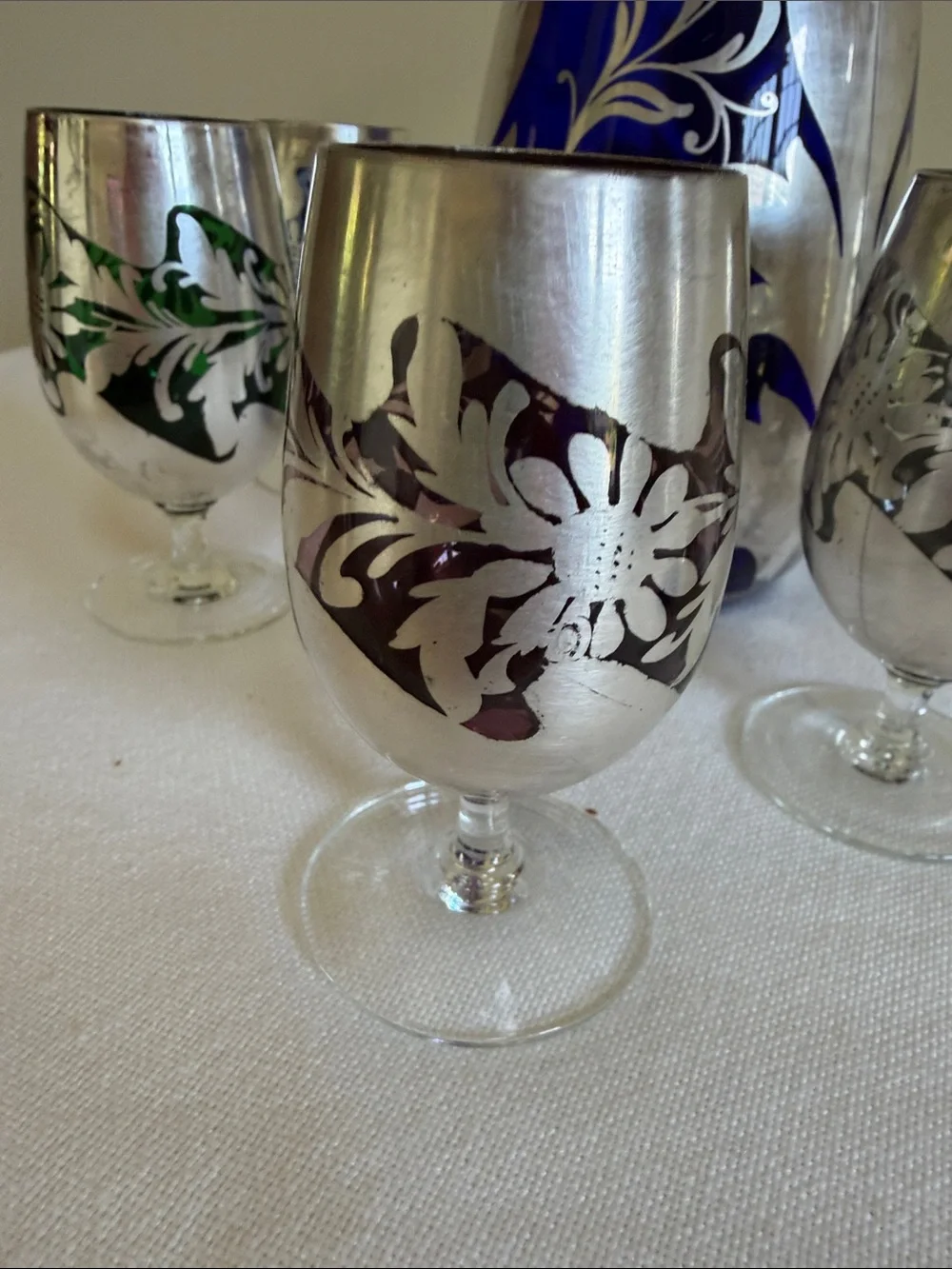 Cobalt blue glass with sterling silver over lay decanter.